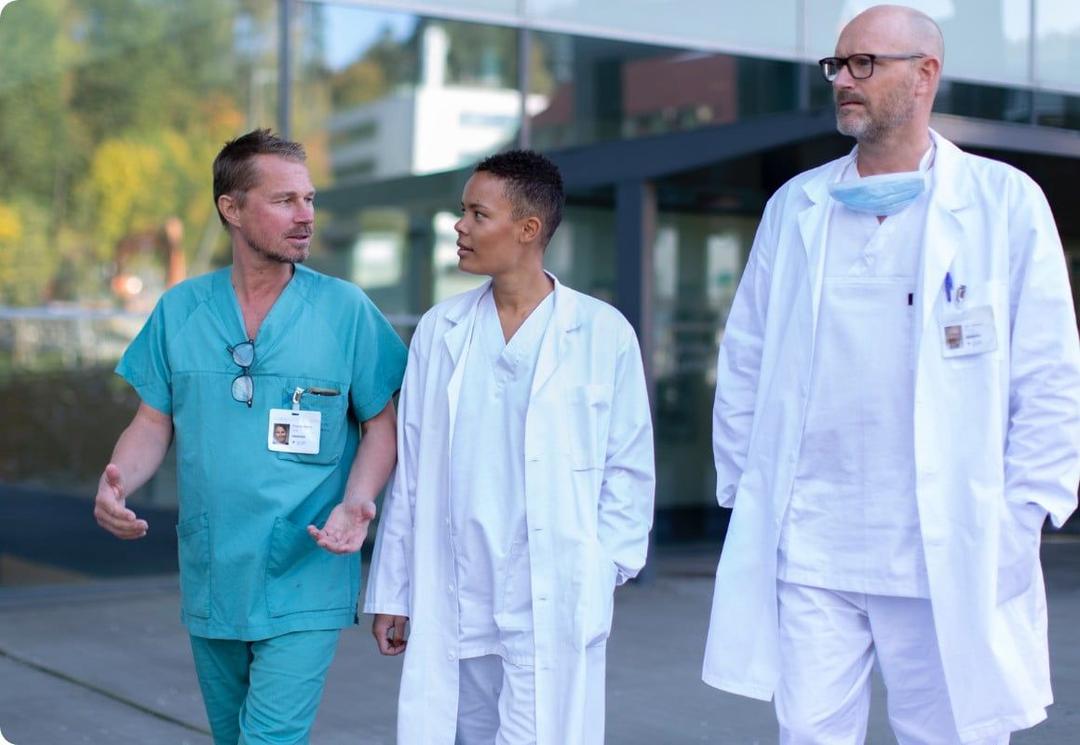 Healthcare professionals walking outside hospital