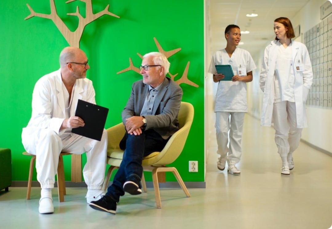 Healthcare professional talking with patient